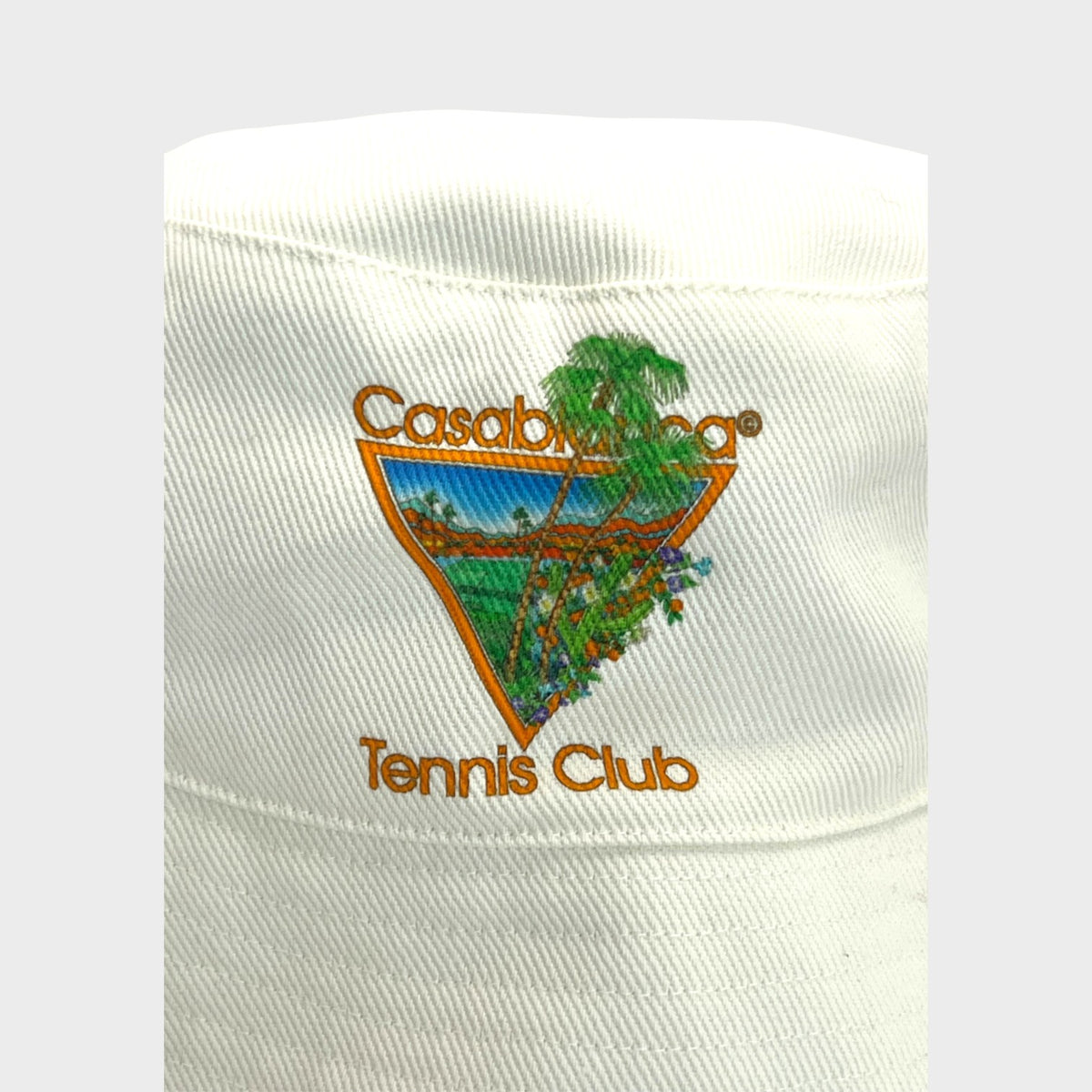 Supplied Fashion white cotton bucket hat featuring a colourful triangular Casablanca Tennis Club graphic print