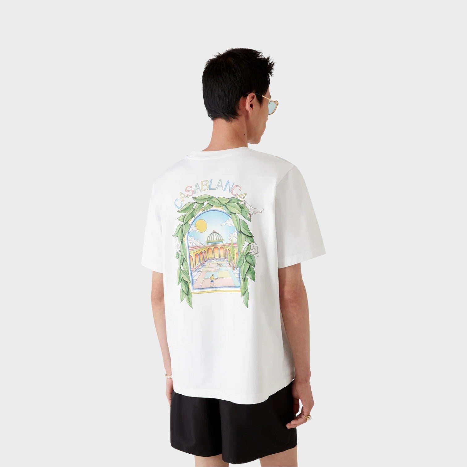 Supplied Fashion white short sleeve t-shirt with a colorful tennis court graphic print on the back