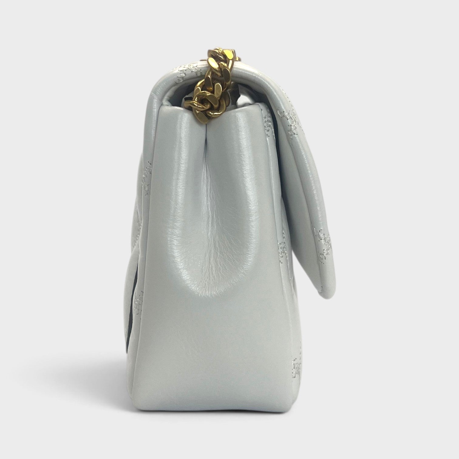 Supplied Fashion Willa glazed white leather shoulder bag with gold chain strap, side view.
