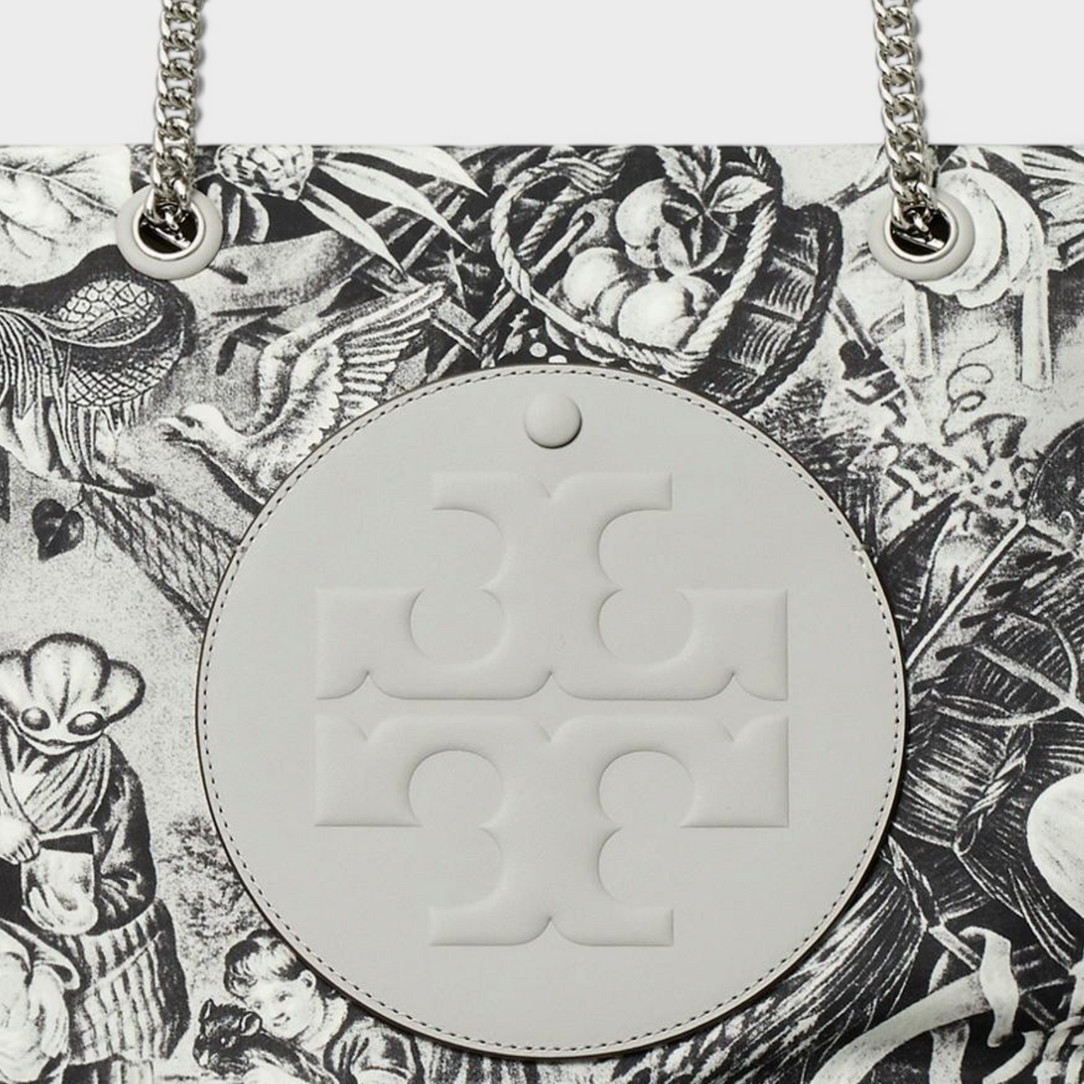 Supplied Fashion Ella grey tote bag featuring an alien print, circular logo patch, and silver chain shoulder straps.